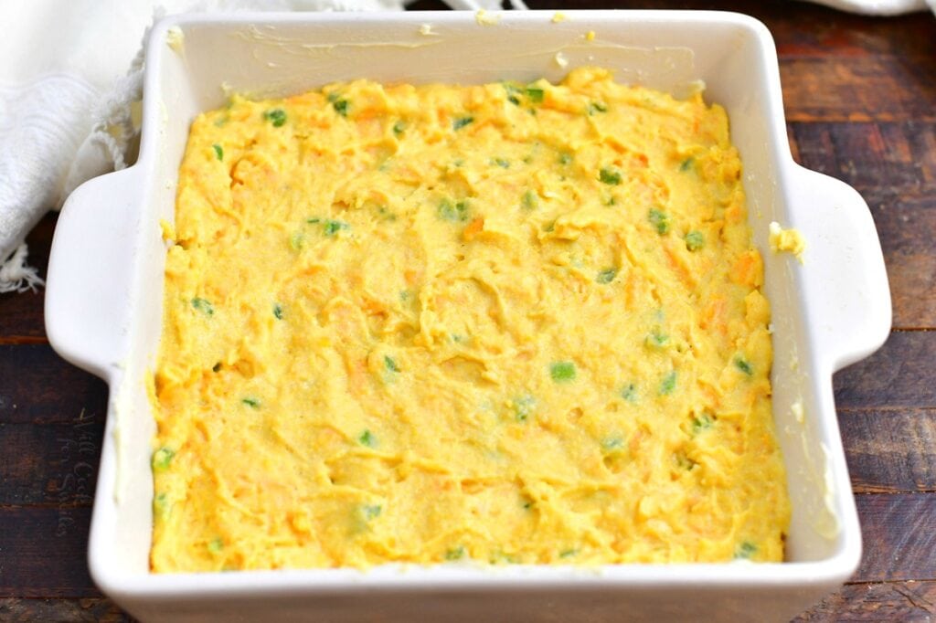 cornmeal bread batter in square white baking dish