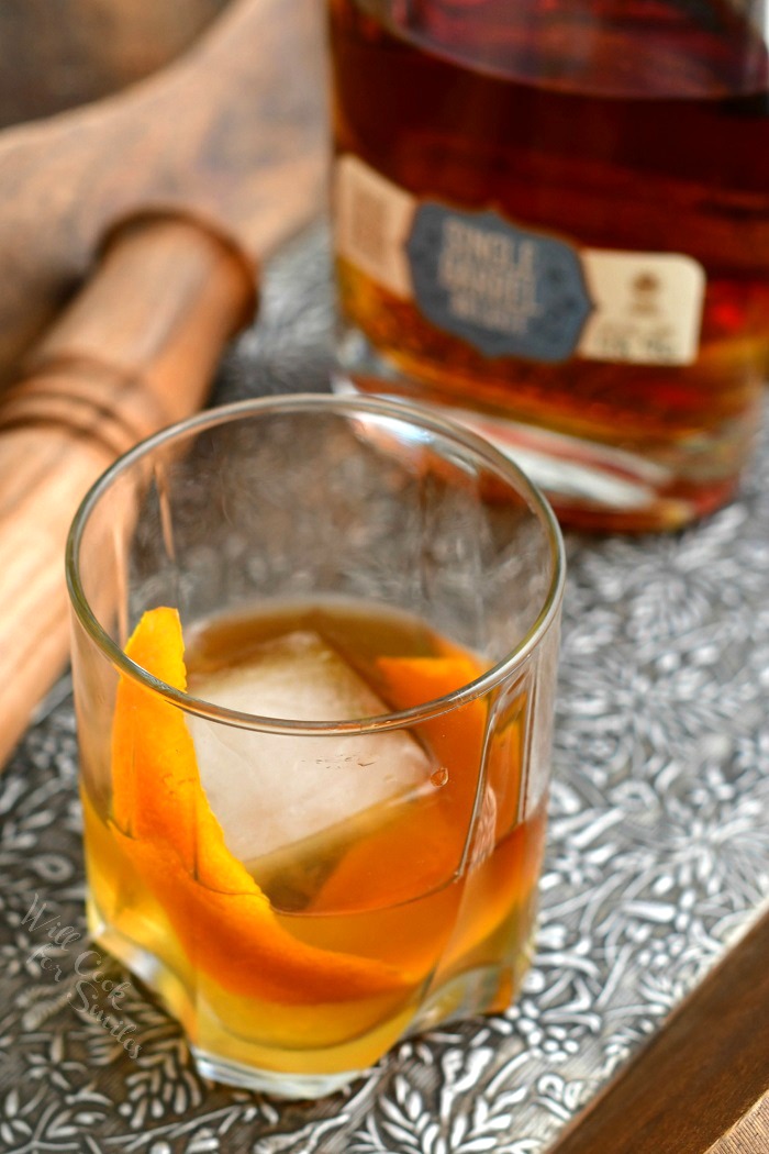 overhead photo of a bourbon Old Fashioned on the rocks with orange peel