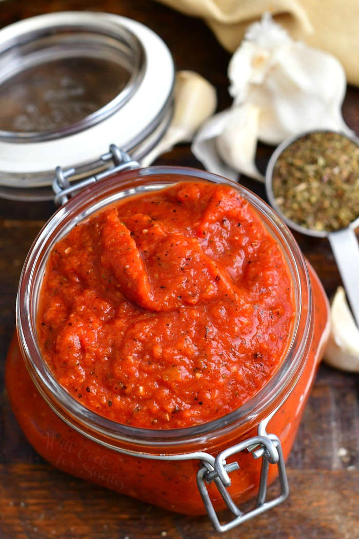 overhead photo: thick red sauce in glass jar