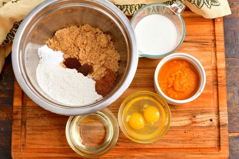 ingredients in mixing bowl and prep bowls to make an easy pumpkin bread recipe