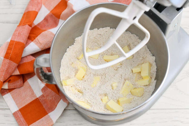 flour and cubes of butter in bowl of a stand mixer