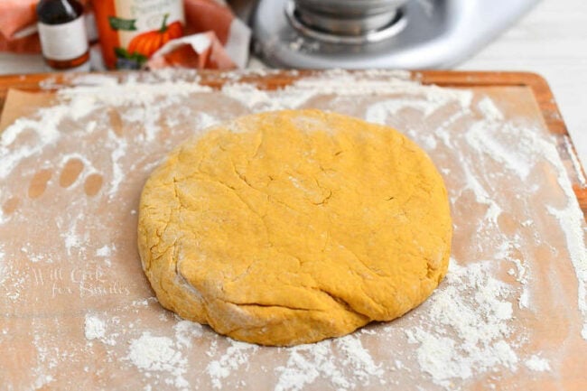 flat, round piece of scone dough on floured counter top
