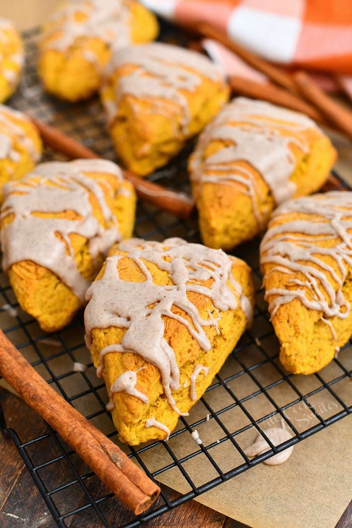 glazed pumpkin scones on black wire cooling rack