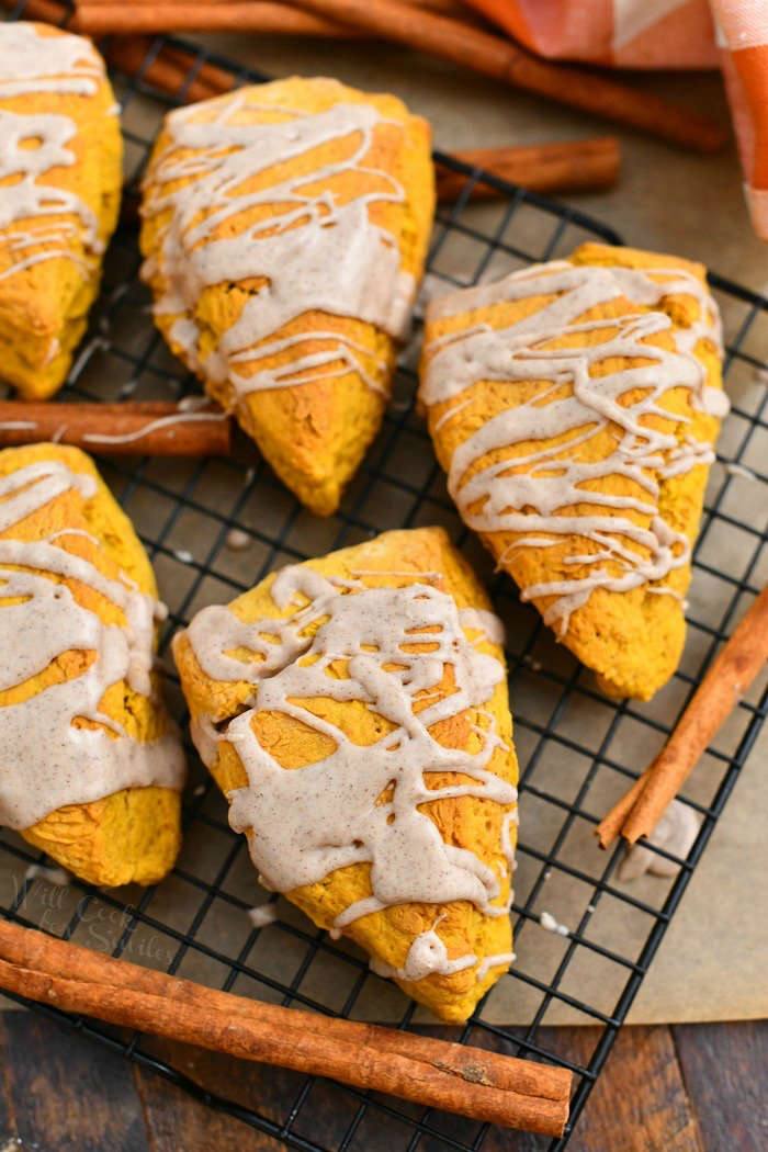 overhead photo: English biscuits drizzled with glaze cooling on wire rack