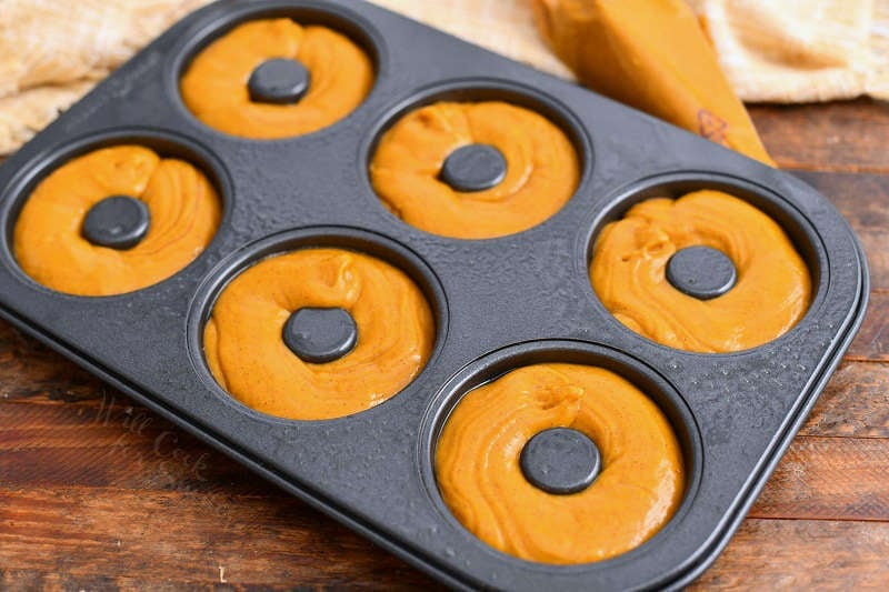 batter in a donut pan for a baked donut recipe