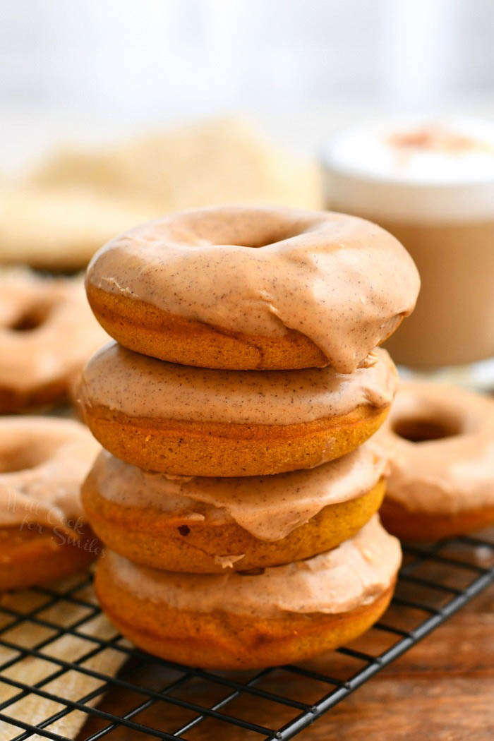 side view: stack of baked doughnuts with pumpkin spice latte glaze