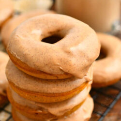 stack of 4 pumpkin spice donuts with glaze on top