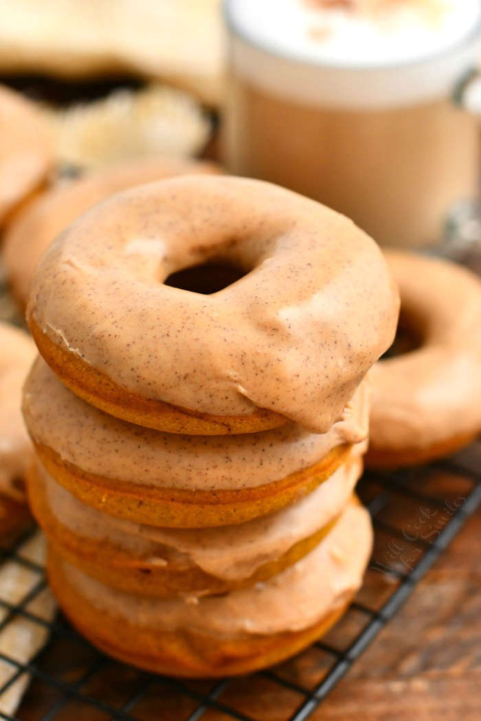 stack of 4 pumpkin spice donuts with glaze on top