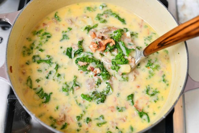 overhead photo: making Zuppa Toscana recipe in large soup pot on stove