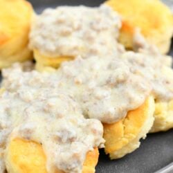 golden biscuits covered in sausage white gravy