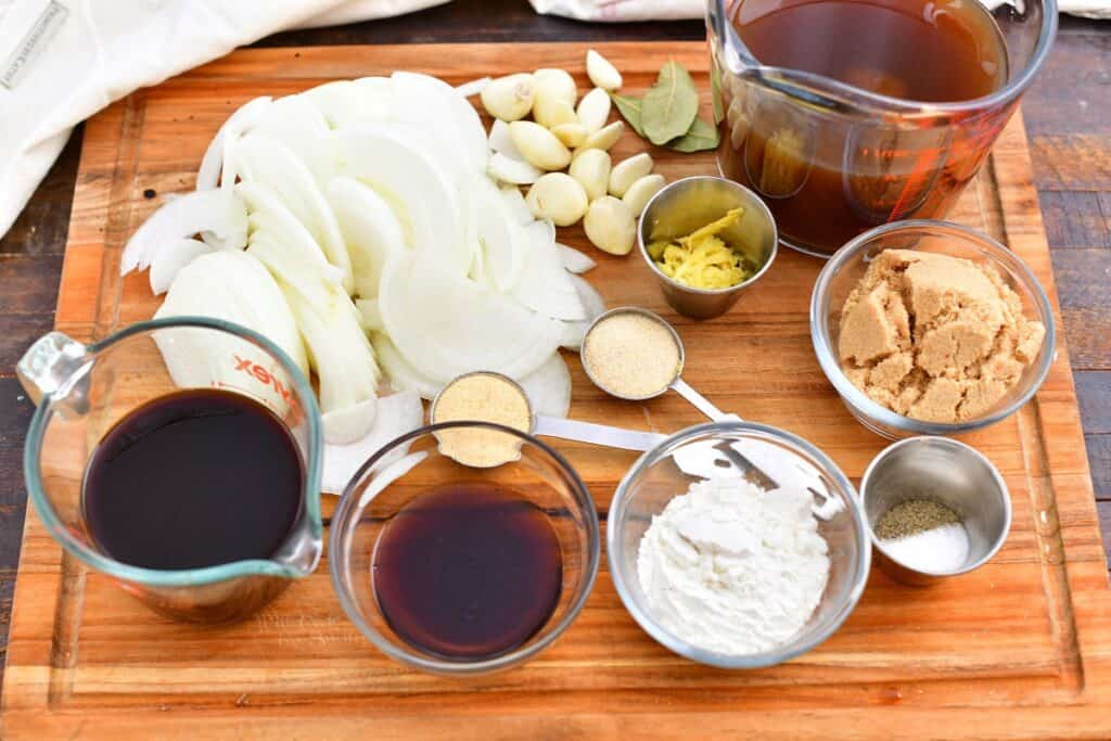 ingredients on cutting board, in measuring cups and bowls to make oven roasted brisket recipe