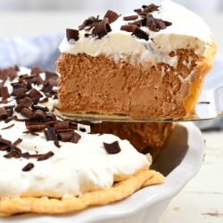 side view: removing slice of chocolate mousse pie from the pan