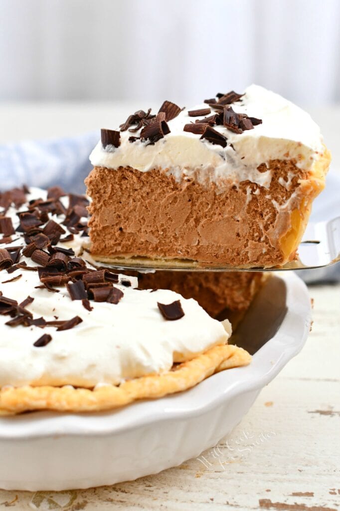 side view: removing slice of chocolate mousse pie from the pan