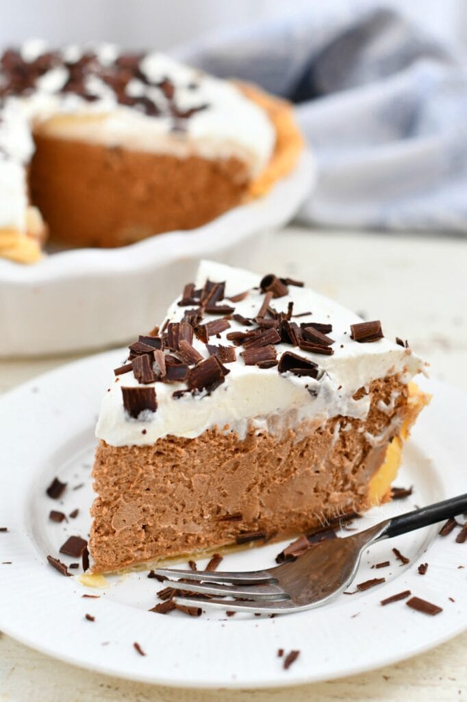 homemade French silk pie on a white plate with fork