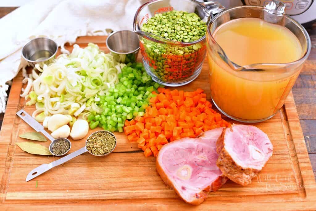 ingredients on a cutting board for making split pea soup with ham