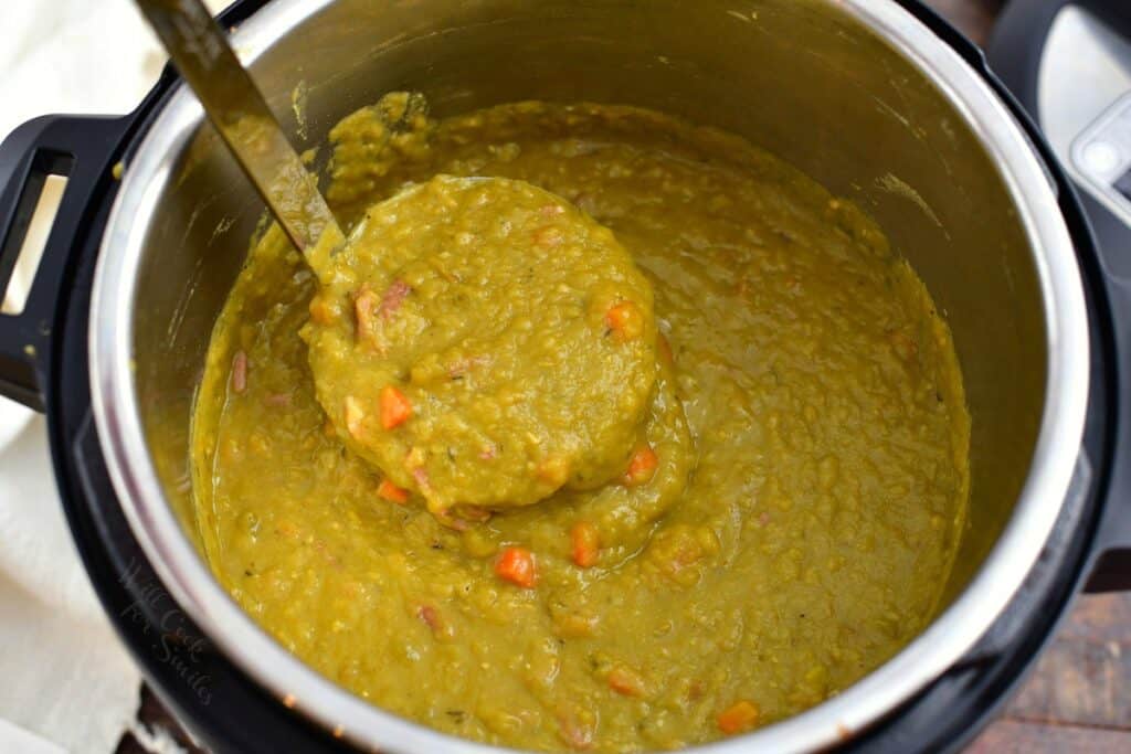 ladle full of thick green soup in an Instant Pot