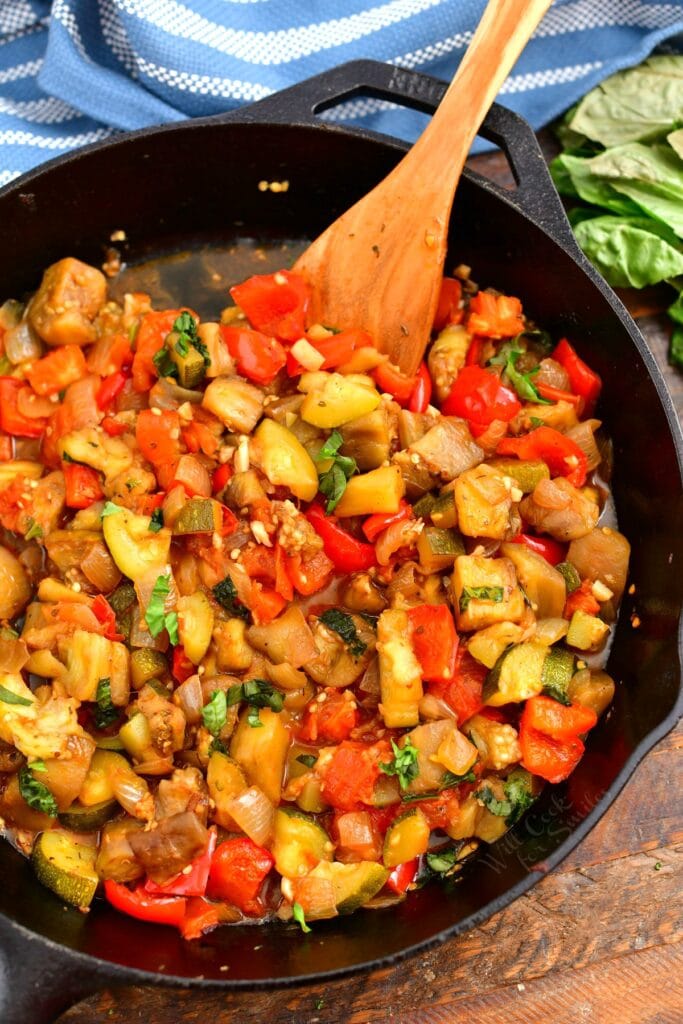 overhead photo: ratatouille recipe cooking in black sillet