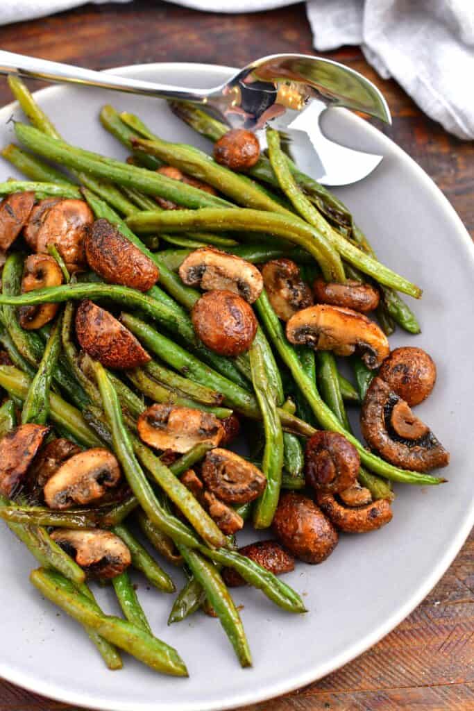 overhead photo: serving bowl of roasted fresh green beans and mushrooms