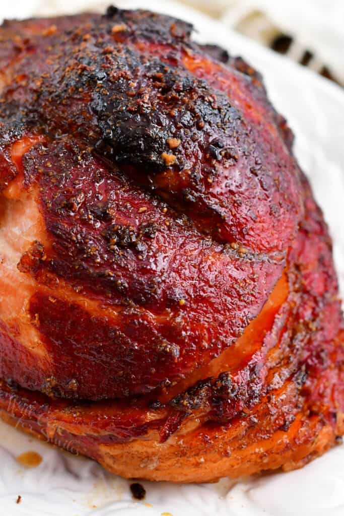 closeup image: crispy baked ham on serving platter