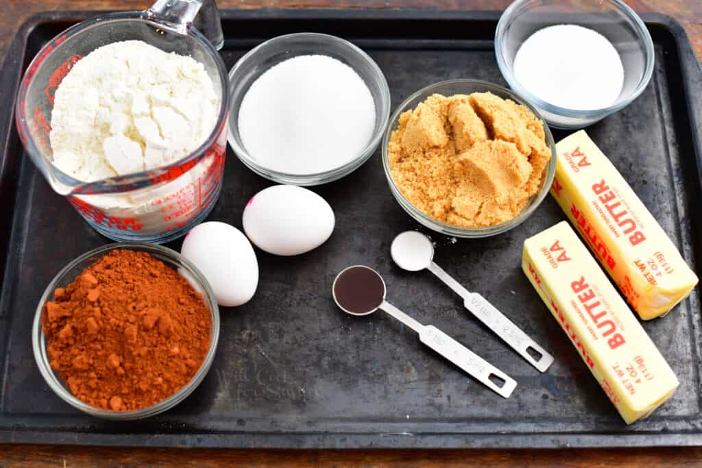 overhead image: cookie recipe ingredients in small bowls and measuring cups