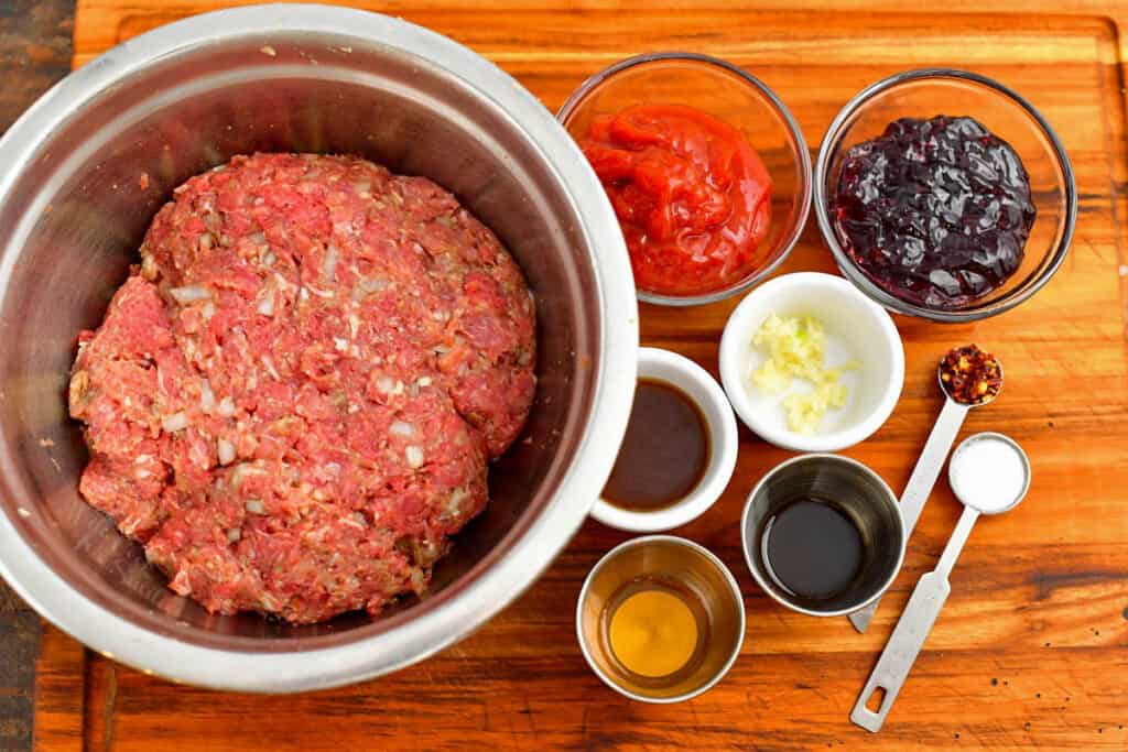 ingredients in prep and mixing bowls to make a party meatball recipe