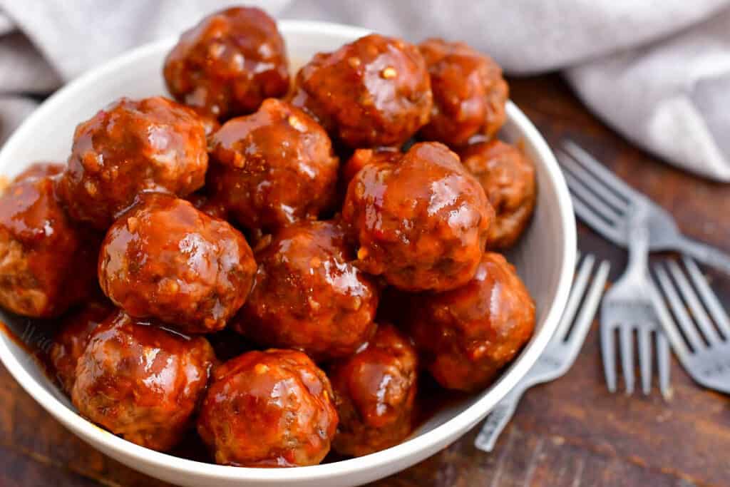 bowl of cocktail meatballs with chili and grape jelly sauce