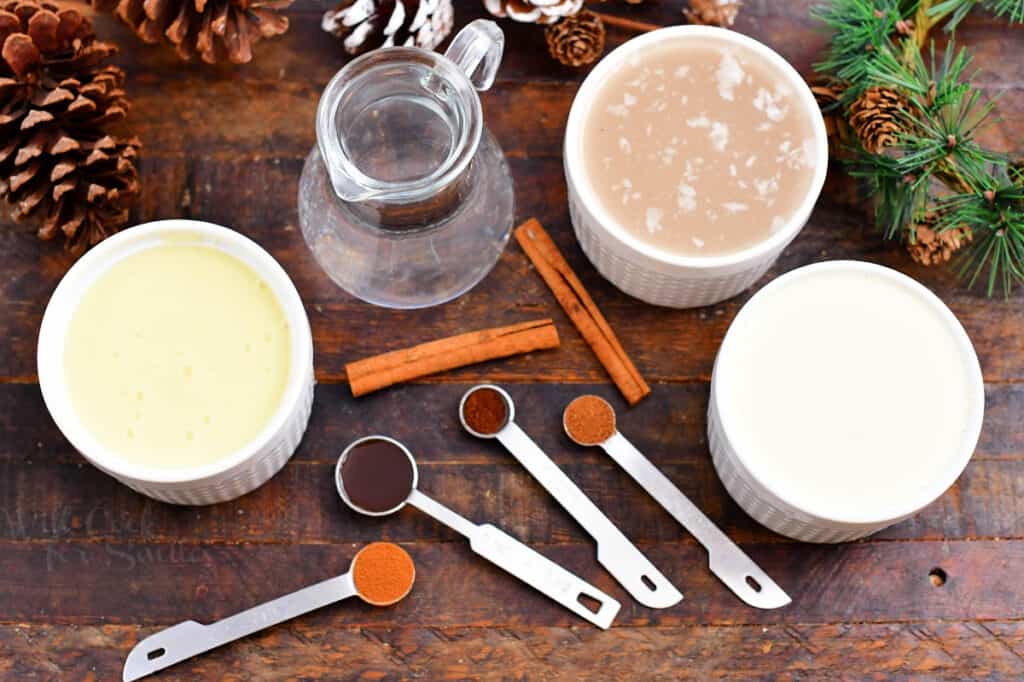 ingredients in bowls and measuring spoons to make a coquito recipe