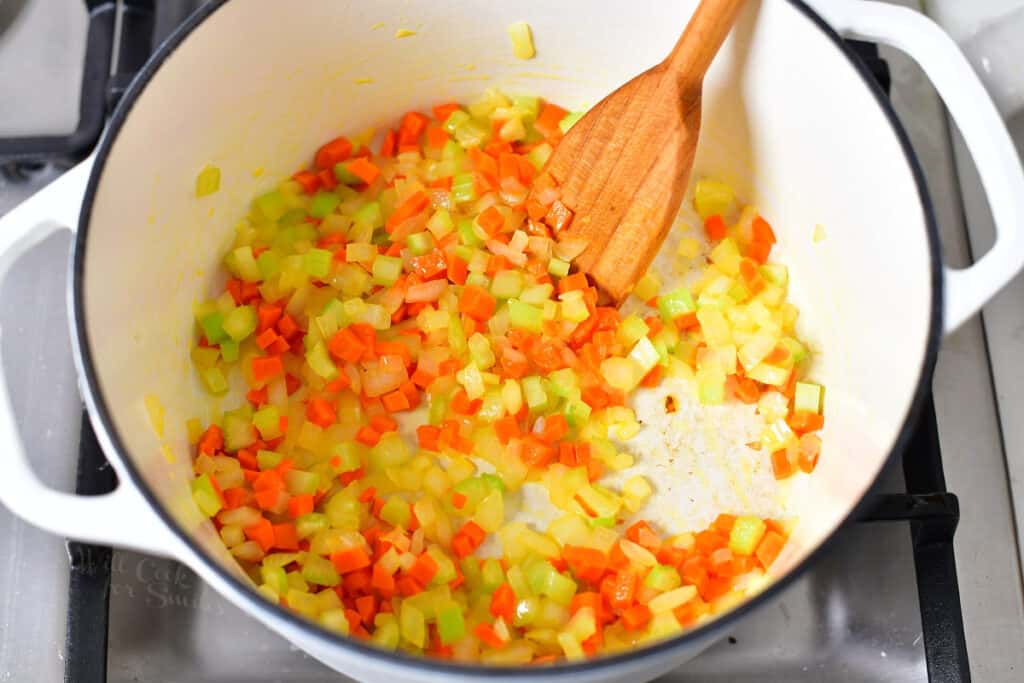 overhead image: sauteing diced onion, carrot, and celery in large pot