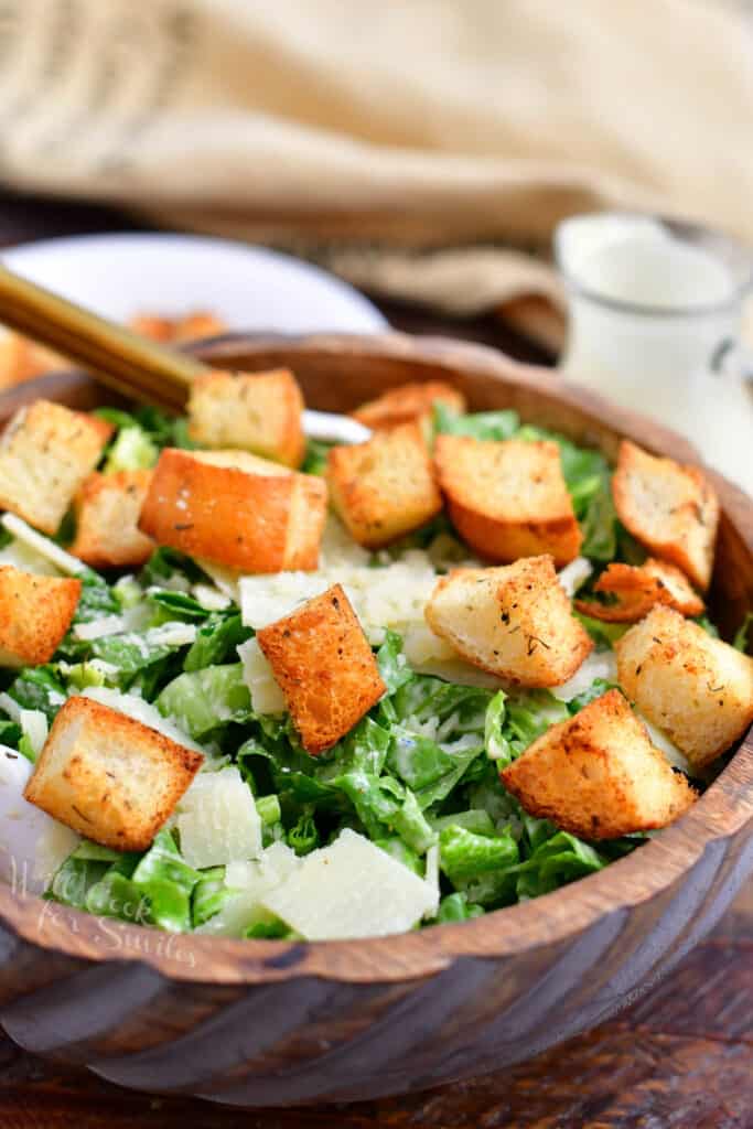 bowl of caesar salad with garlic croutons