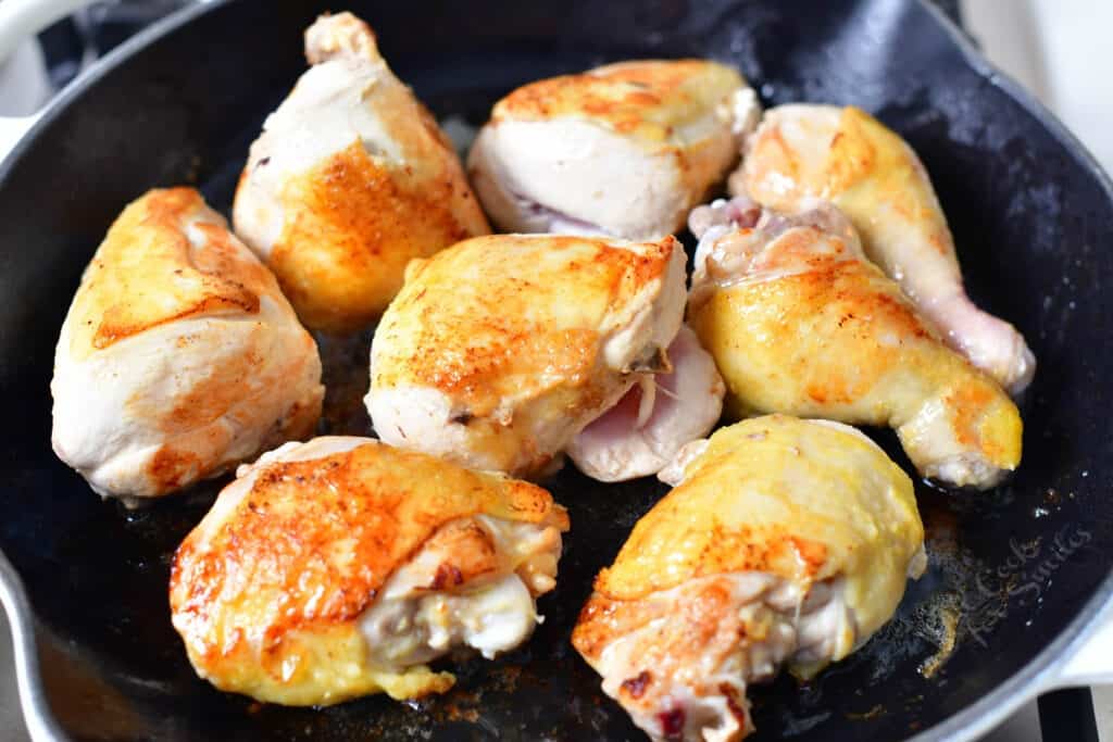 browning chicken pieces in cast iron skillet