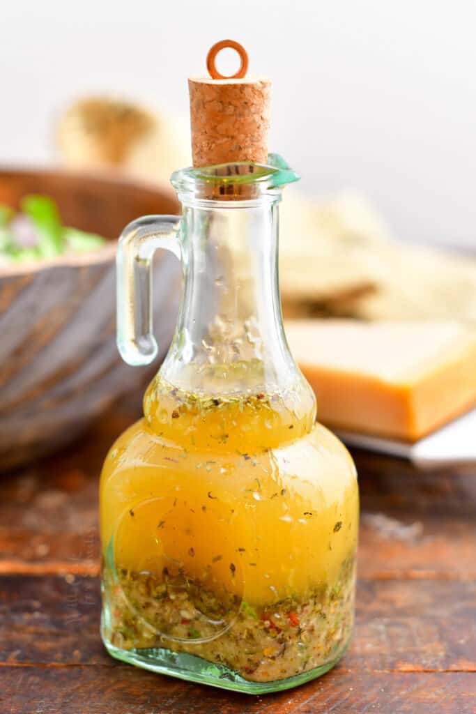 Italian vinaigrette dressing in glass bottle