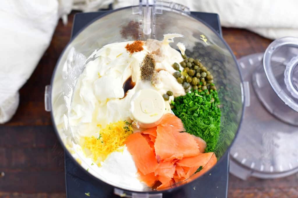overhead image: salmon dip recipe ingredients in bowl of food processor