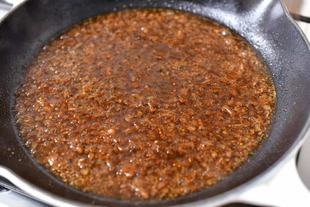 beef stock mixture simmering on the stove