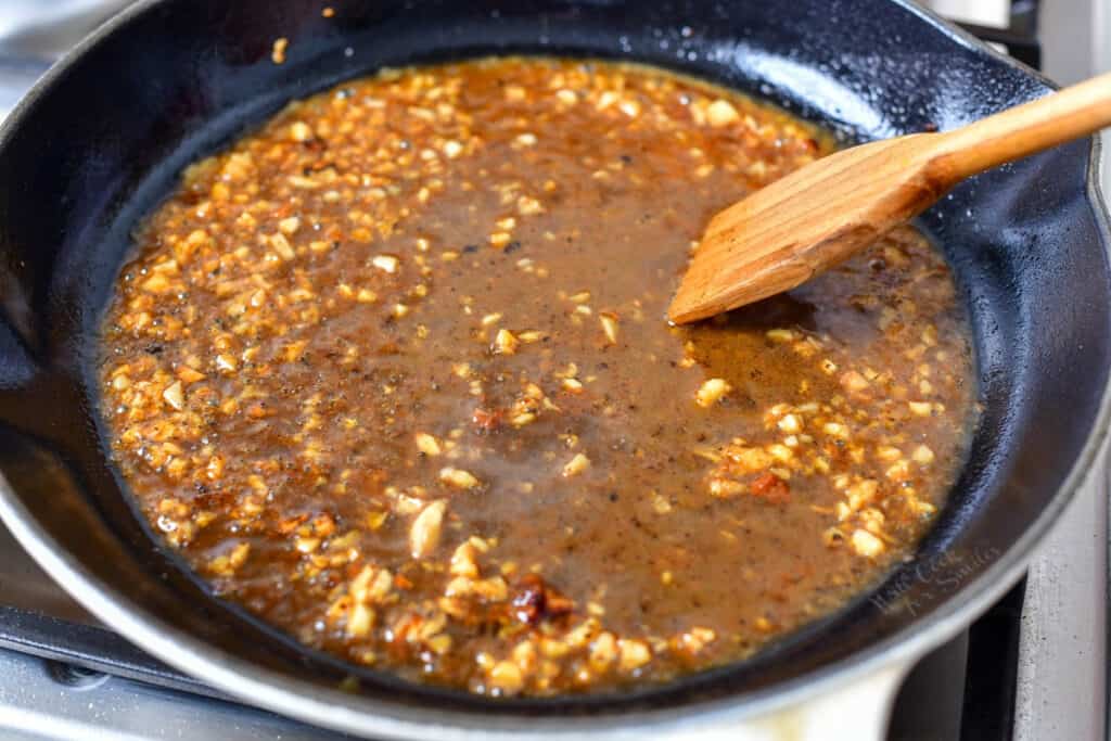pan of garlic and shallot sauteing in a pan of butter