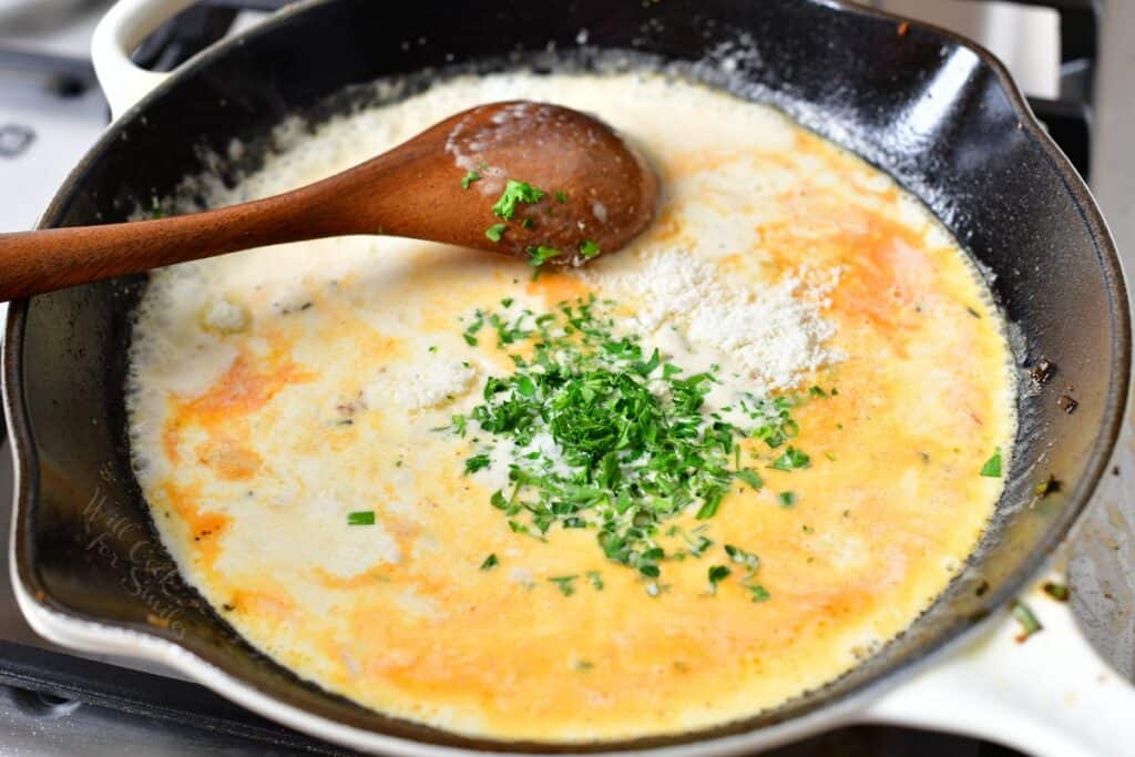 stirring flour into skillet of seafood stock