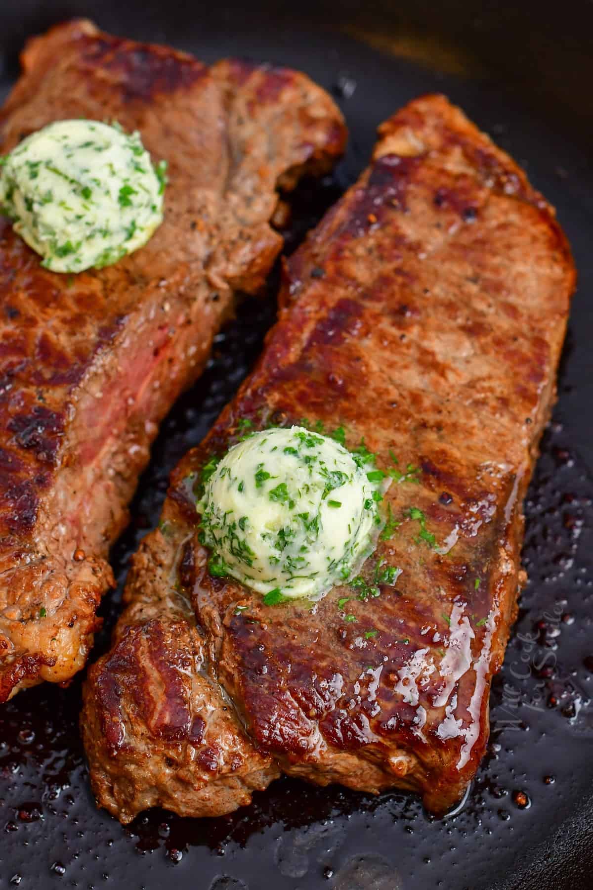 cast iron steak topped with compound butter