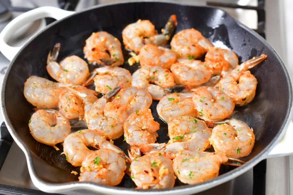 shrimp cooking in skillet with oil