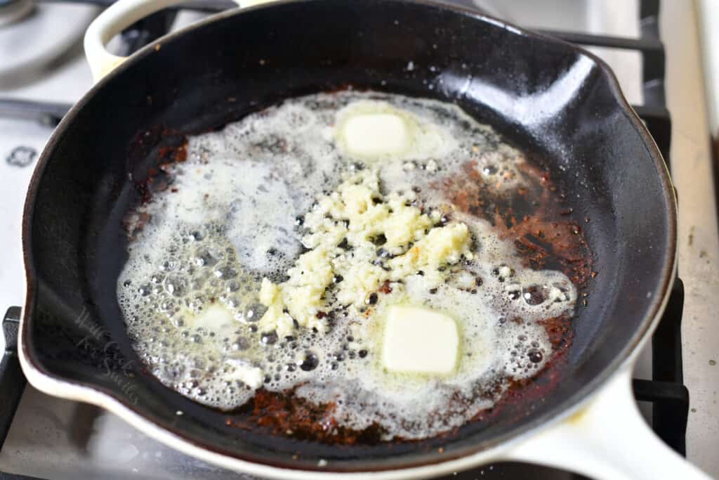 melting butter with minced garlic in a pan
