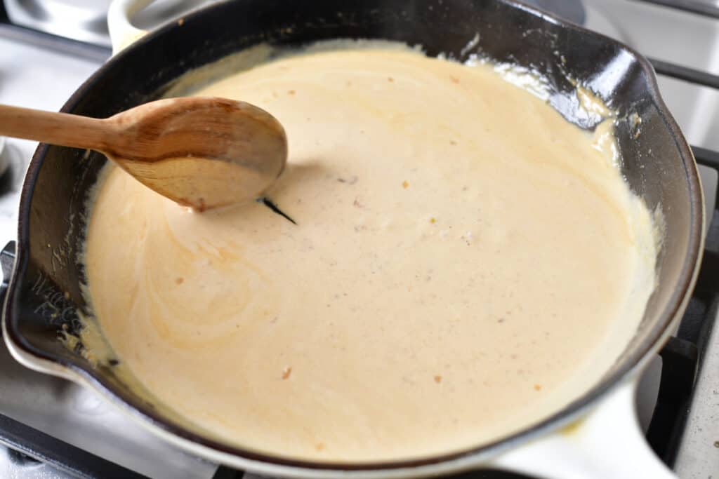stirring cream sauce for scallops