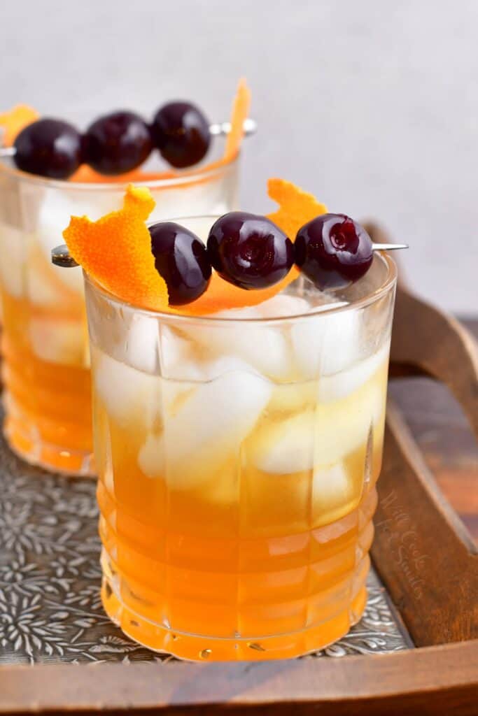 Two glasses of amaretto sour cocktail are ready to be enjoyed.