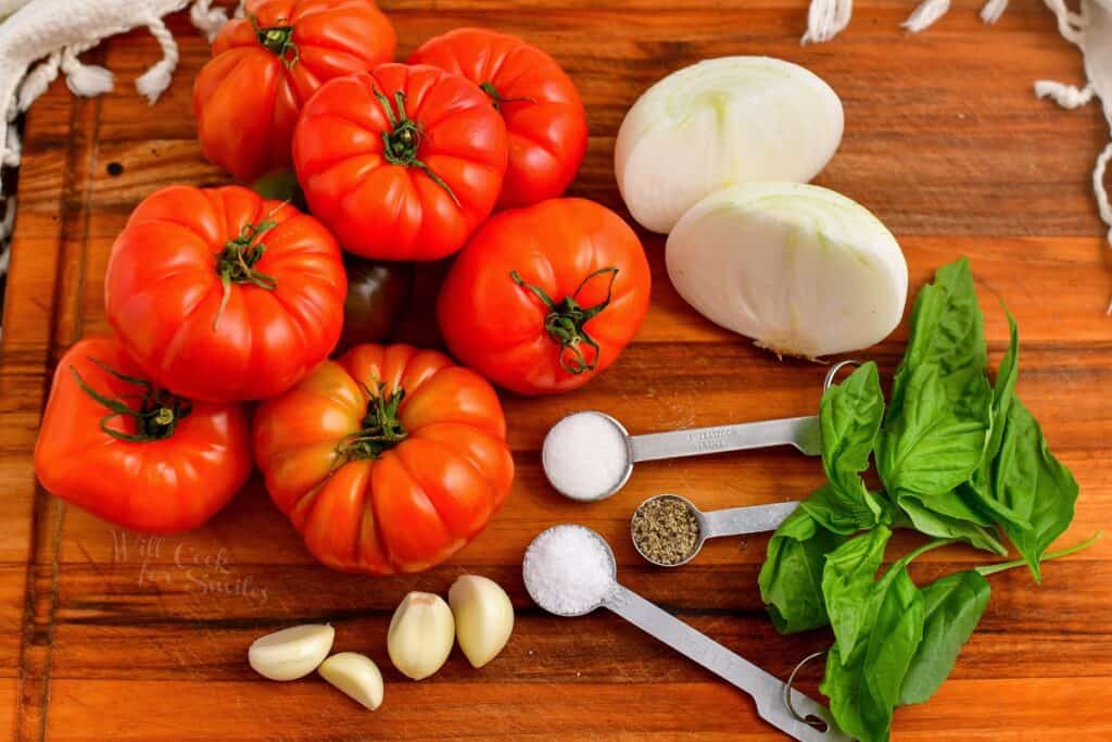 ingredients for Pomodoro sauce on a wooden cutting board