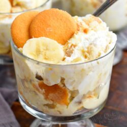 A serving of banana pudding is in a small glass.