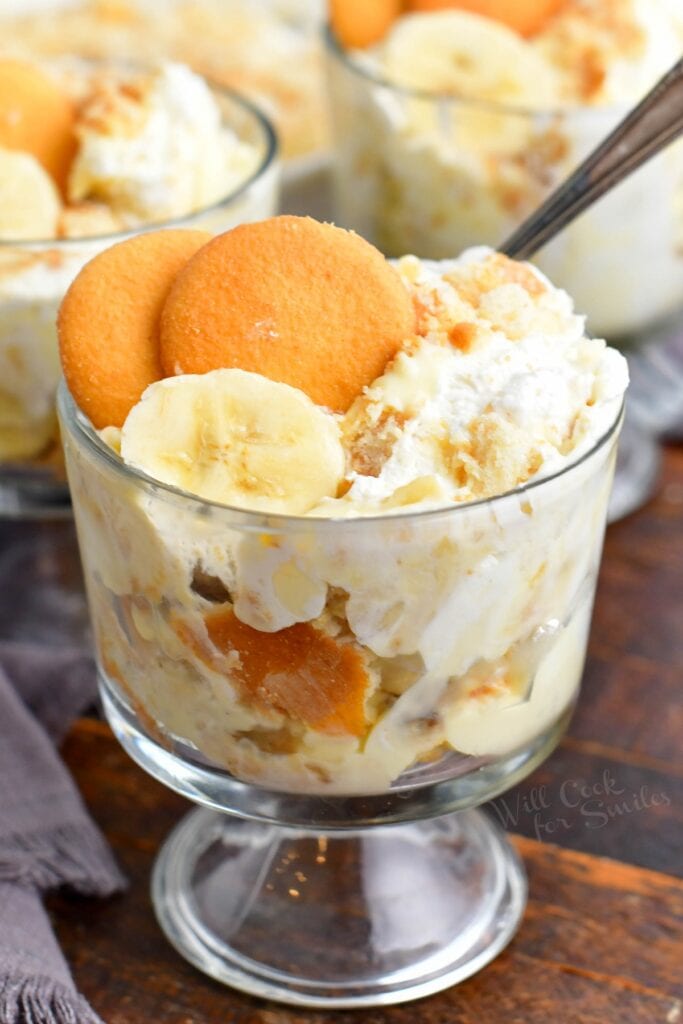 A serving of banana pudding is in a small glass.