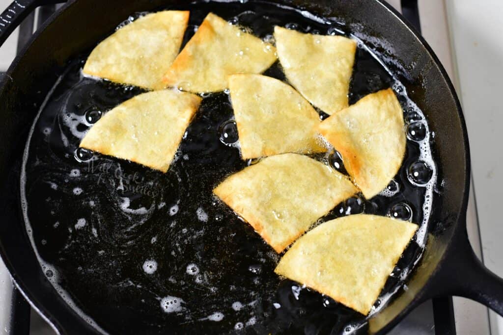 Chips are being cooked in oil.