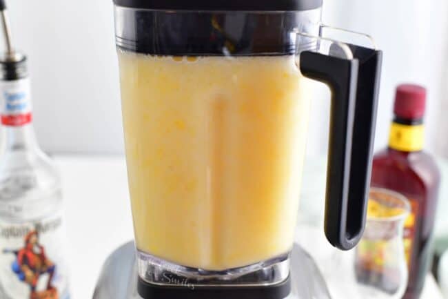 Pina Colada is being blended in a blender. 