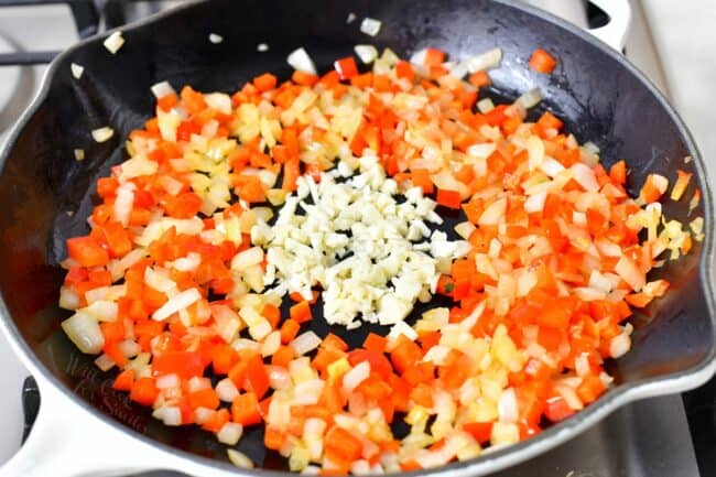 Garlic is added to the skillet.