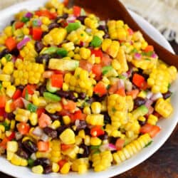 Black bean and corn salad is on a large white plate.