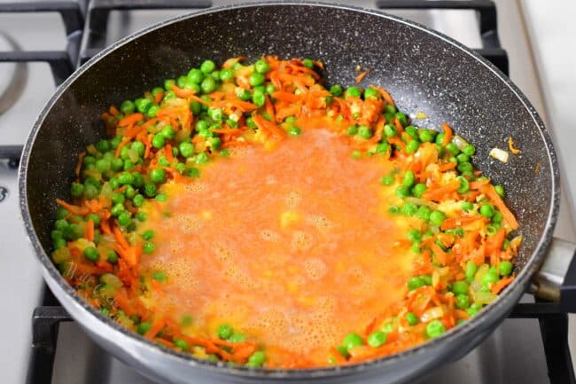 The egg mixture has been added to the center of the pan.