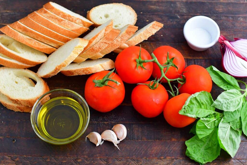 ingredients for bruschetta on a wooden surface