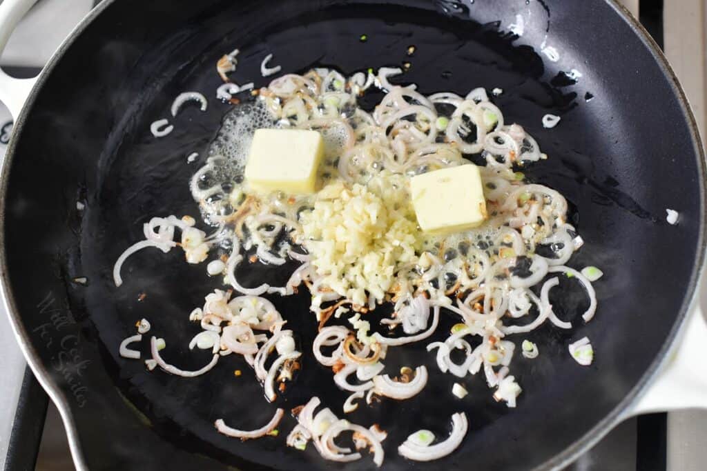 butter garlic and shallots in a cooking pan